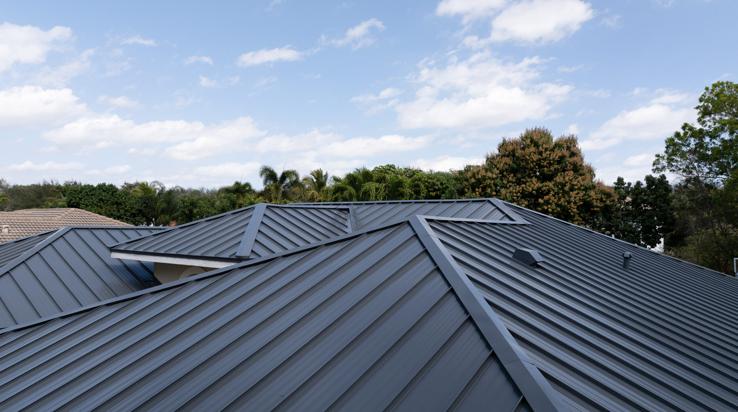 Modern metal roofing installation on residential home